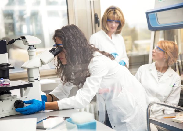 photo-of-real-female-scientist-looking-into-a-micr-2023-11-27-04-55-39-utc